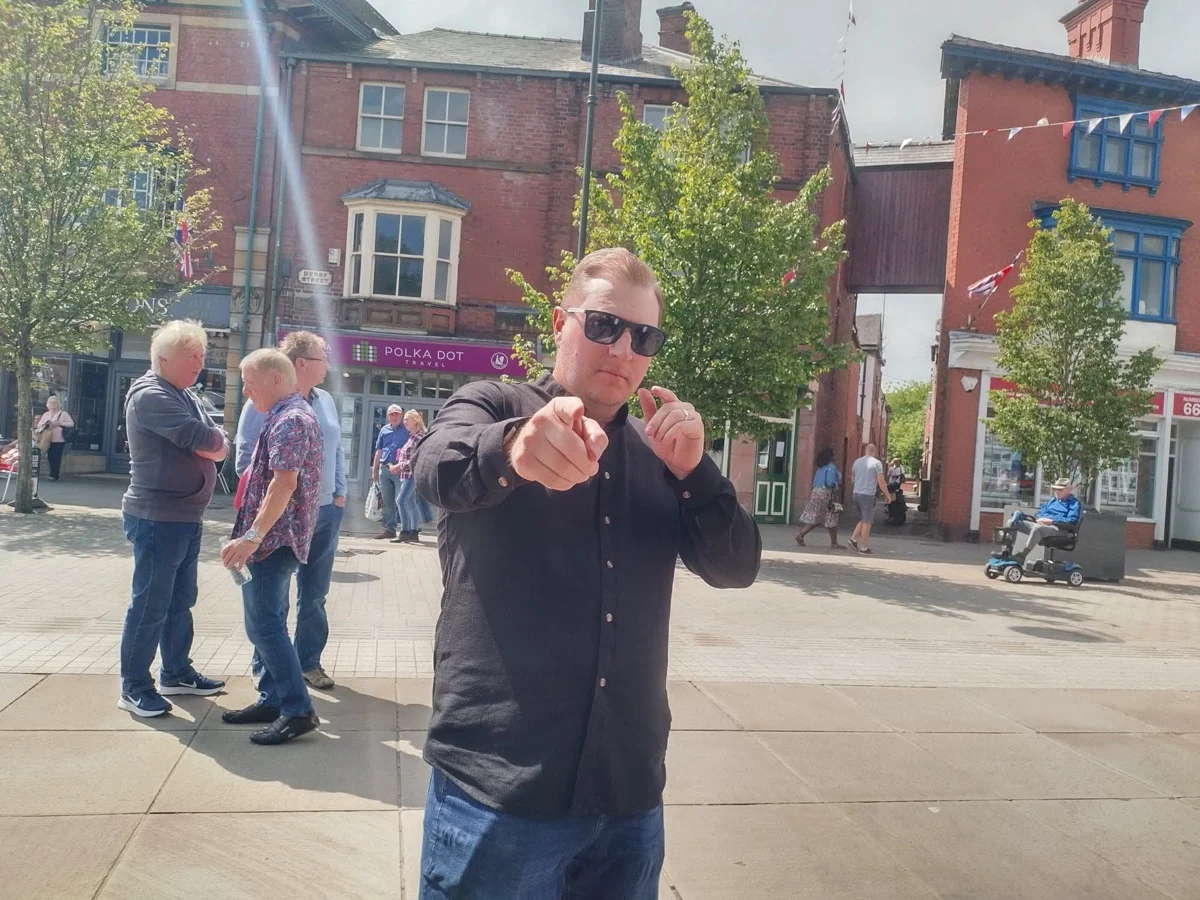 Archive photograph of Mark singing outdoors in Leek